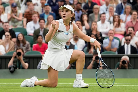 Lulu Sun reacts after winning a point against Emma Raducanu
